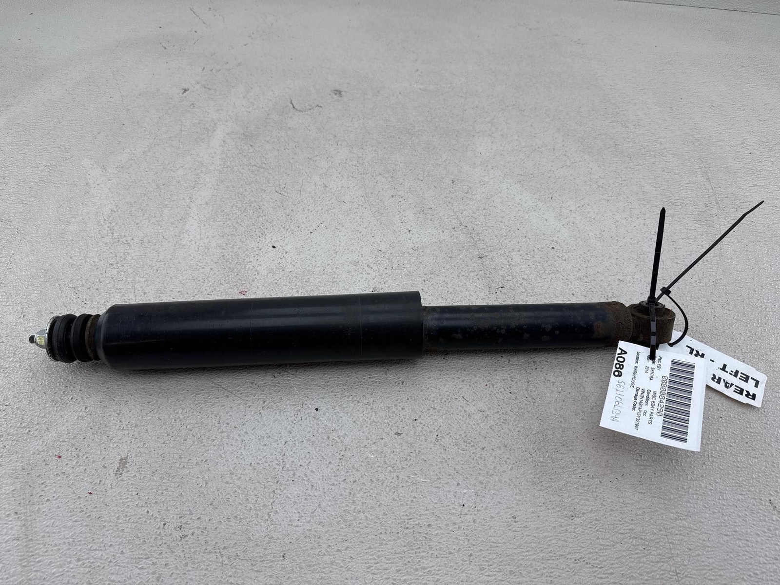 2013-2019 Nissan Sentra Rear Left Suspension Shock Absorber Black Oem